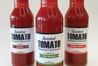 Three bottles of Twisted Tomato Gourmet Ketchup in Bacon, Dill Pickle, and Ghost Pepper flavors, lined up against a plain white background.